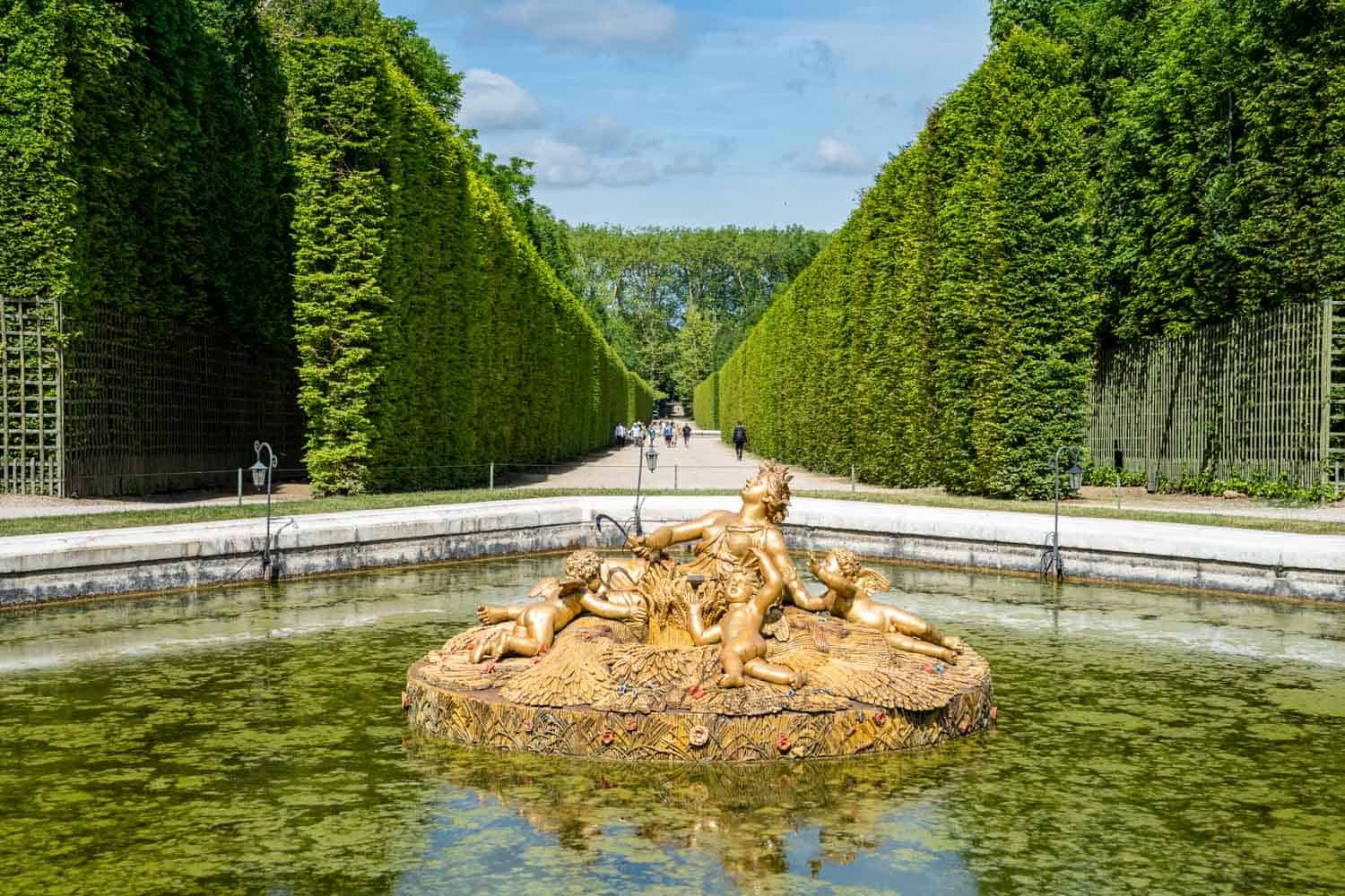 Golden fountain inside the Gardens of Versailles