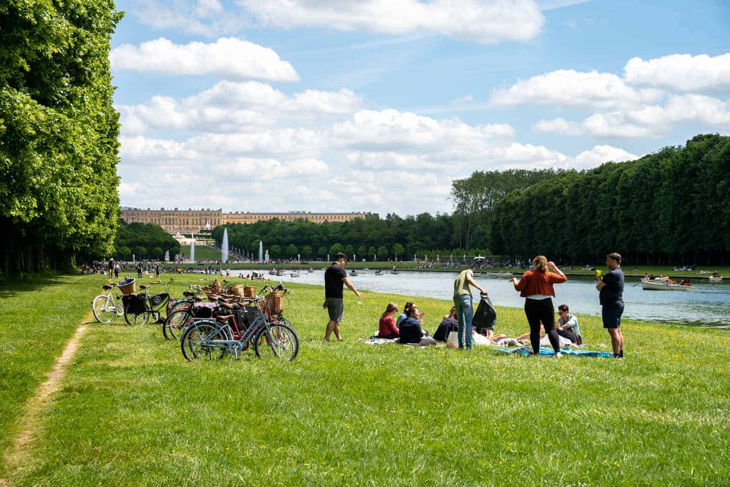 Bike tour stopped along the Grand Canal at Versailles | Best Versailles day trip